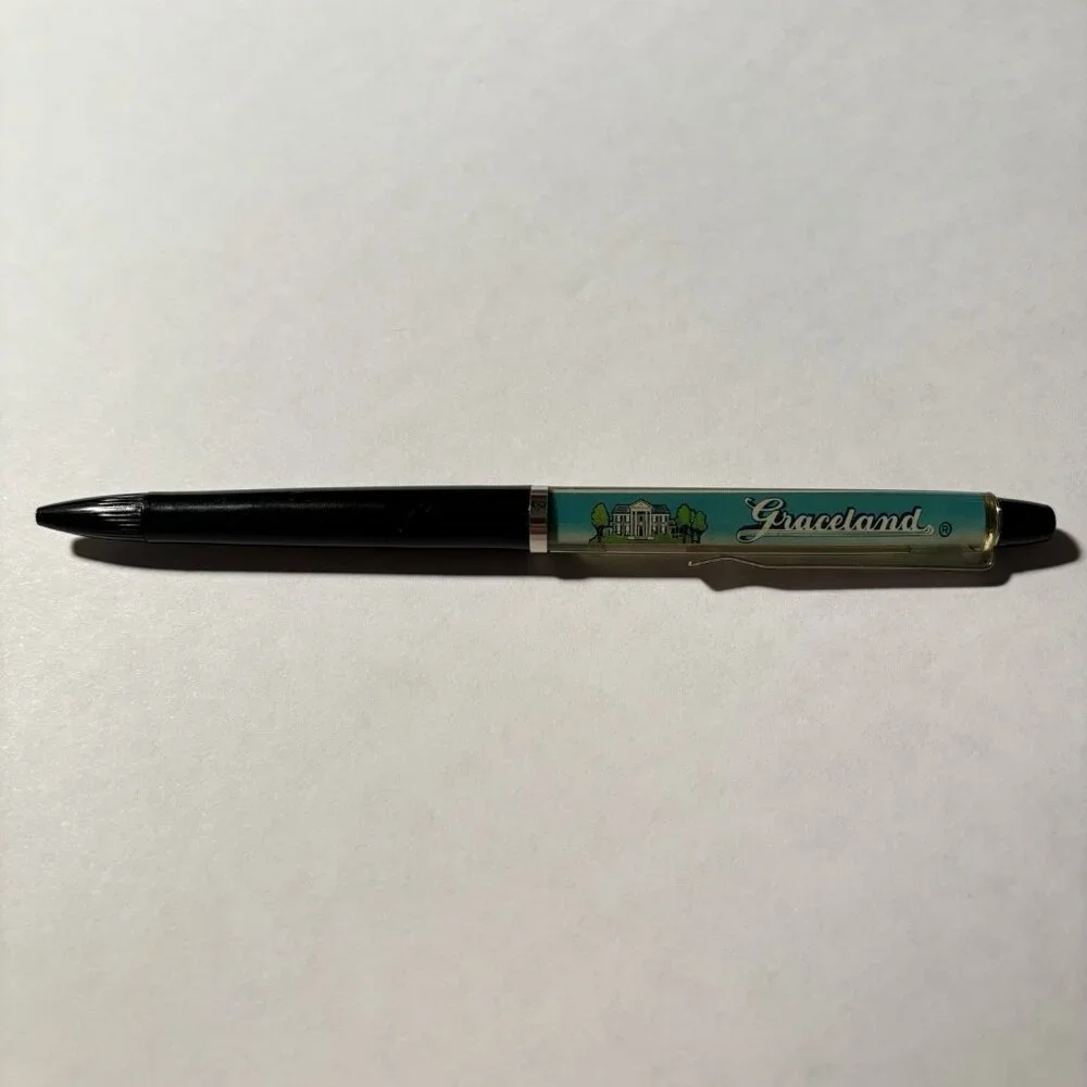 Graceland Floaty Pen Home of Elvis Presley Pink Cadillac Moves Souvenir Novelty